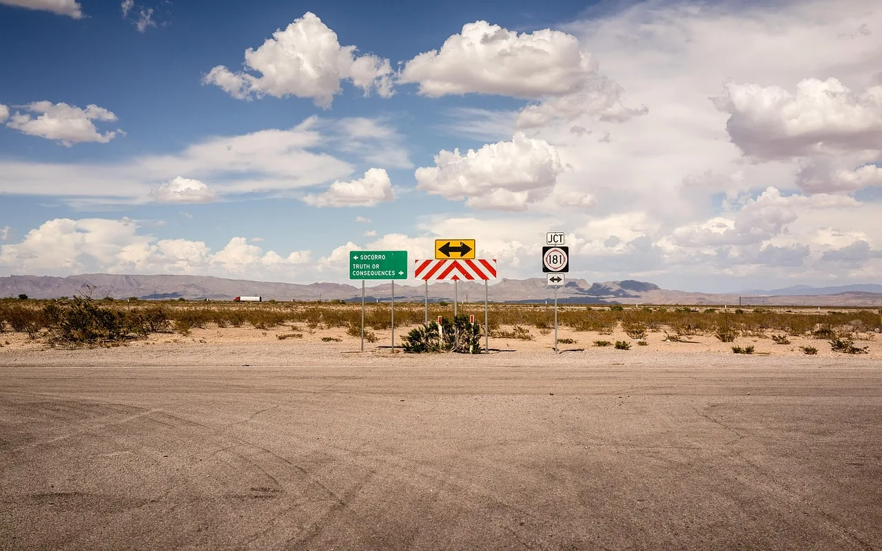 clouds, mountains, road, signs, sky, road signs, street signs, street, travel, horizon, rural, countryside, landscape, nature, desert, road, road, road, road, road, street, street, desert, desert. Roadside design studio visits cost: a per-stop breakdown