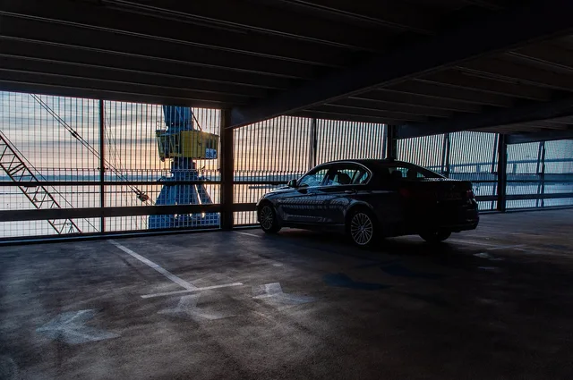 multi storey car park, automobile, parking spot, building, urban, automobile, automobile, automobile, automobile, automobile, building, building, building, building. Roadside studio visits on a shoestring: gas, tolls and parking by region